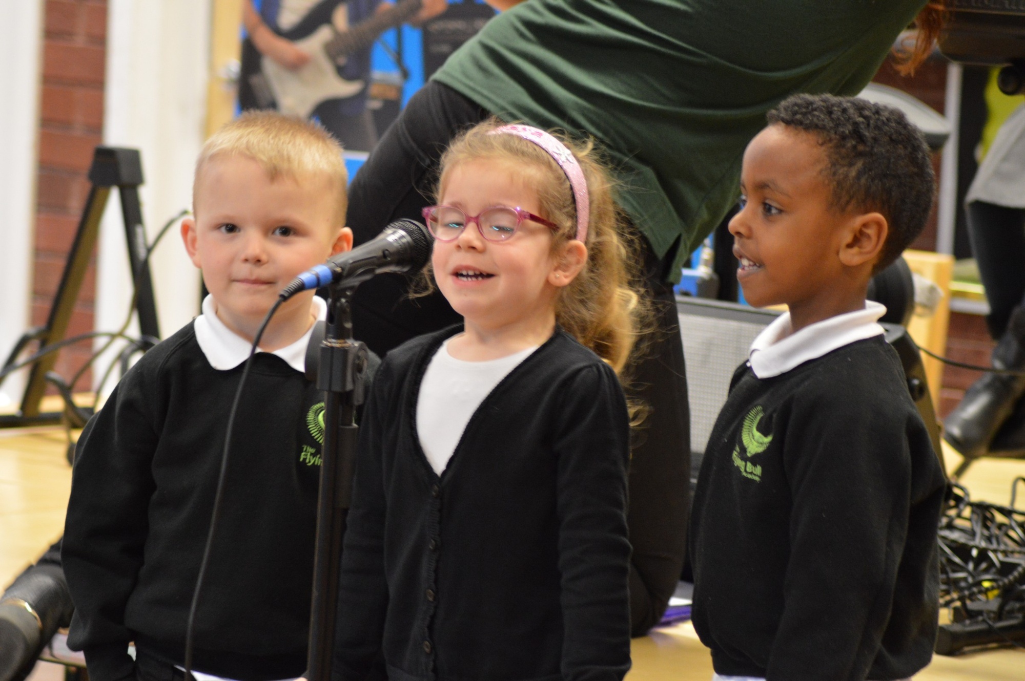 Children singing on stage