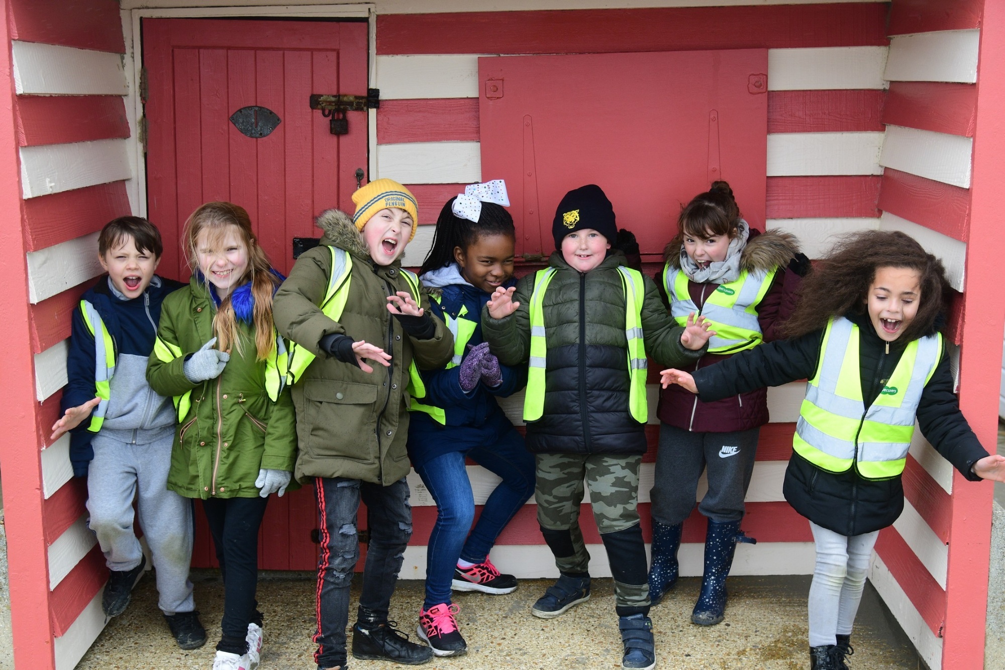 Children posing for image with hi vis on 